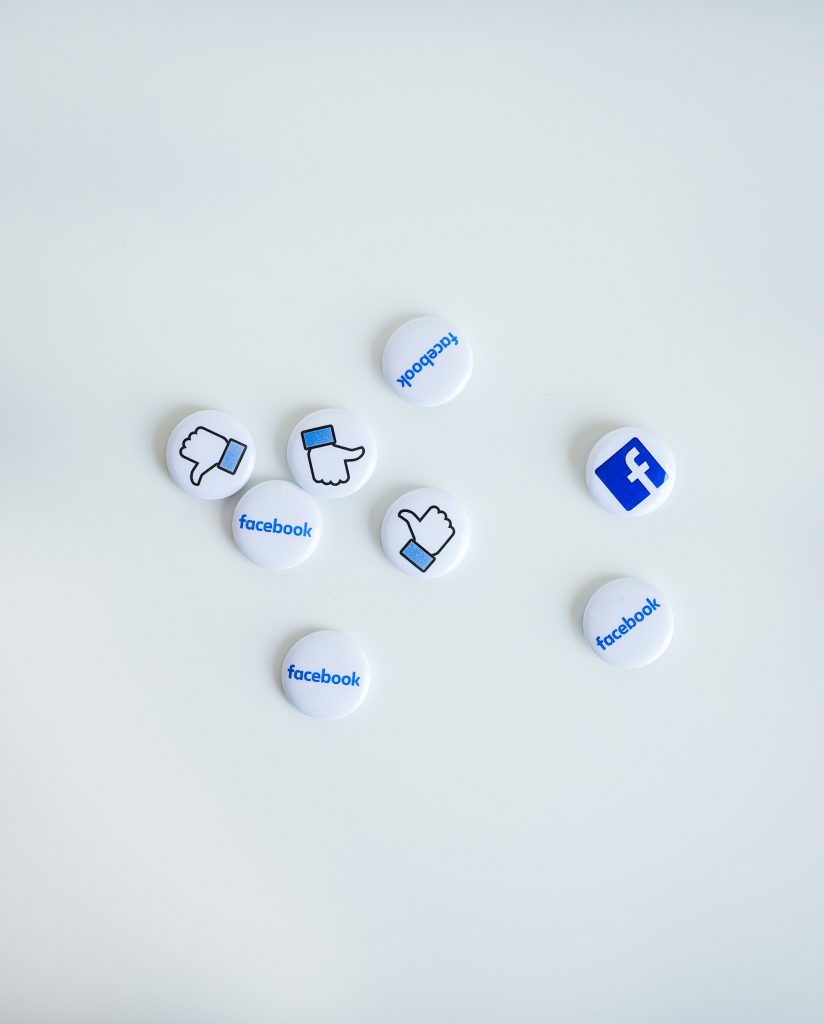 8 white and blue buttons that include icons associated with Facebook, including the Facebook name, Facebook logo, and the Facebook "Thumbs Up" Like icon.