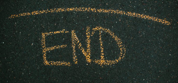 A line with "END" written below it on the pavement.