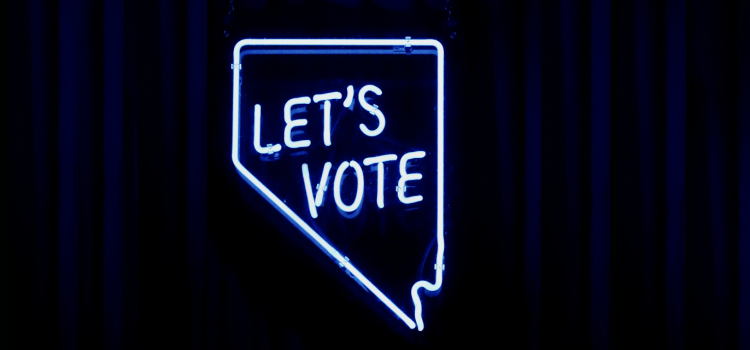 A light fixture in the shape of the state of Nevada with "LET'S VOTE" inside the state.